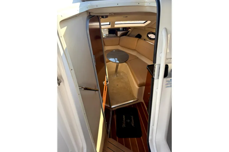 Slide: The Image of Interior view of 2011 Regal 2565 Express Cruiser with cozy seating and table. - 8