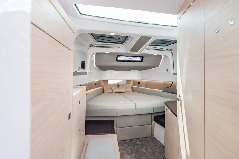 Slide: The Image of Luxurious interior of 2027 Axopar 45 XC Cross Cabin with modern design and cozy seating. - 19