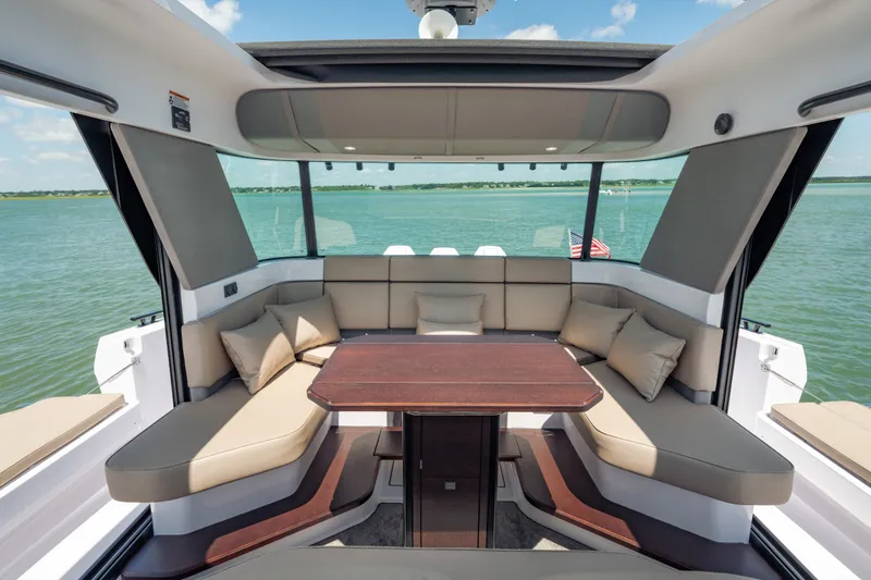 Slide: The Image of Luxurious interior of 2027 Axopar 45 XC Cross Cabin with panoramic water views. - 16