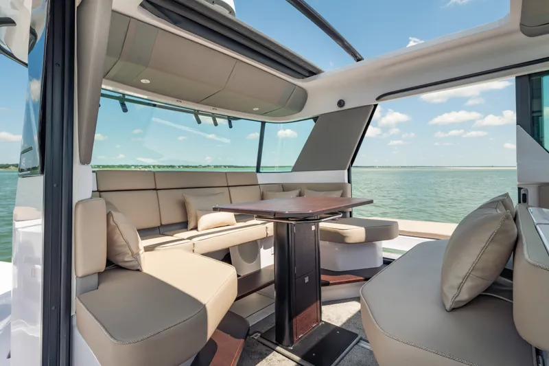 Slide: The Image of Luxurious interior of 2027 Axopar 45 XC Cross Cabin yacht with panoramic water views. - 17