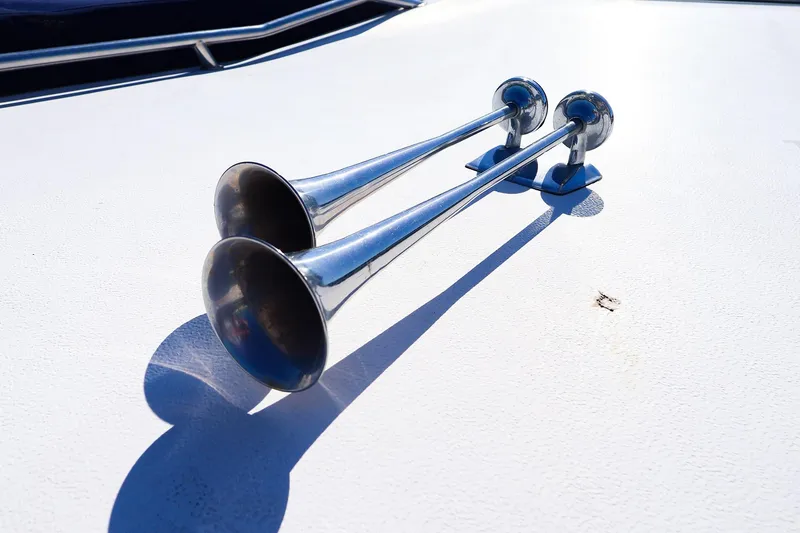 Slide: The Image of Chrome boat horns on 1998 Sea Ray 500 Sundancer deck, shining in sunlight. - 11