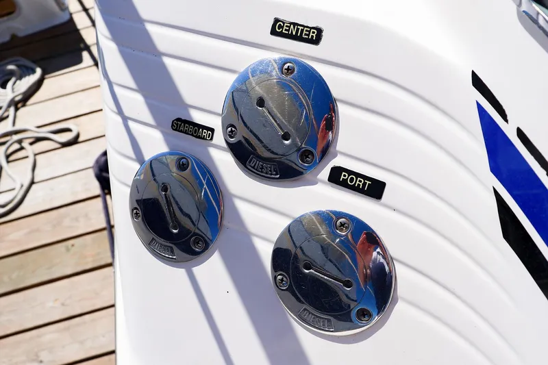 Slide: The Image of Fuel caps on a 1998 Sea Ray 500 Sundancer boat, labeled center, starboard, and port. - 14