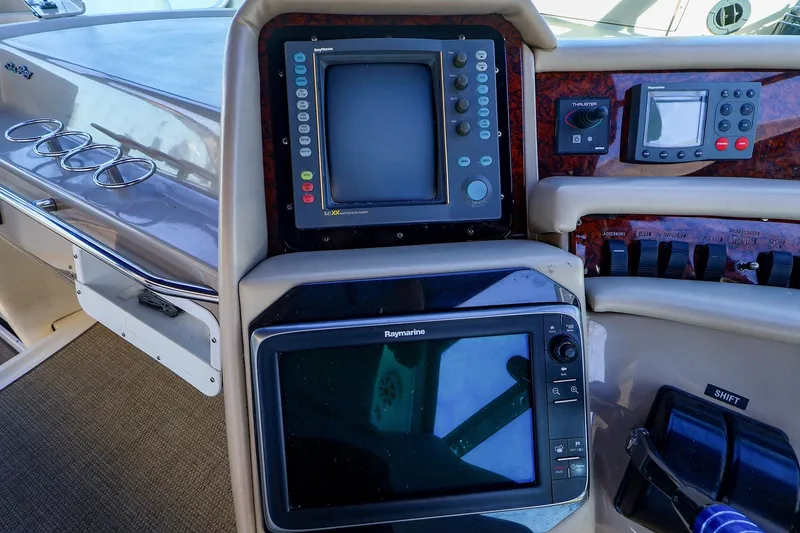 Slide: The Image of Control panel of a 1998 Sea Ray 500 Sundancer yacht with navigation equipment. - 26