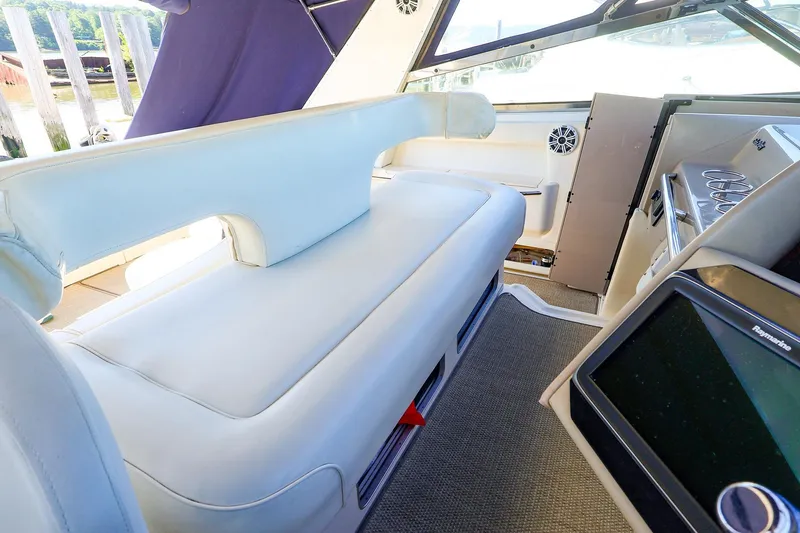 Slide: The Image of Interior of 1998 Sea Ray 500 Sundancer yacht, featuring plush seating and modern controls. - 29