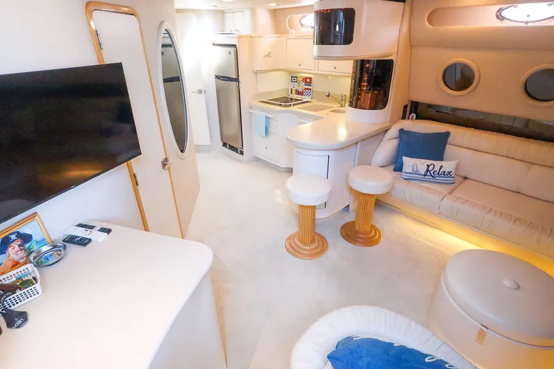 Slide: The Image of Luxurious interior of a 1998 Sea Ray 500 Sundancer yacht with modern amenities. - 31