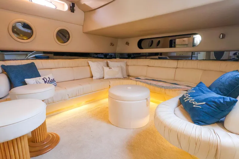 Slide: The Image of Luxurious interior of a 1998 Sea Ray 500 Sundancer yacht with plush seating and ambient lighting. - 33