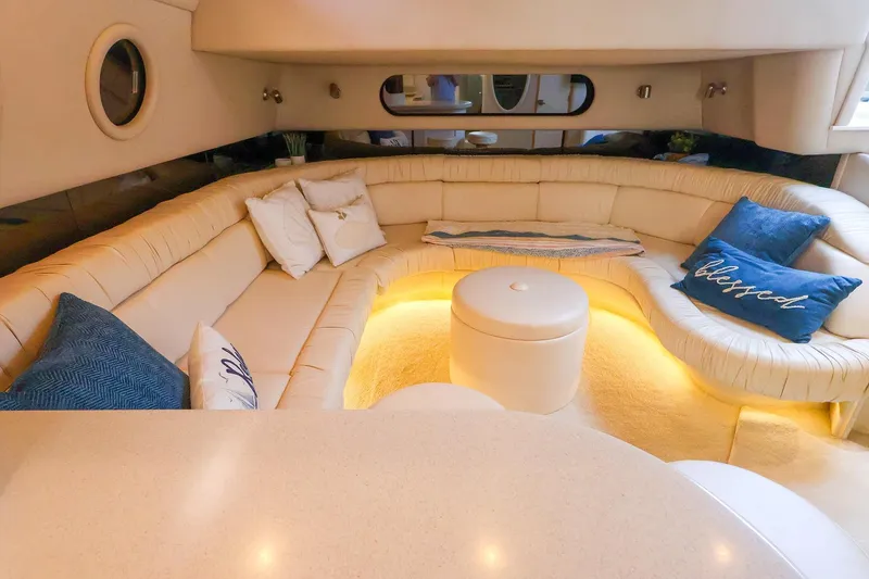 Slide: The Image of Luxurious interior of a 1998 Sea Ray 500 Sundancer yacht with plush seating and ambient lighting. - 34