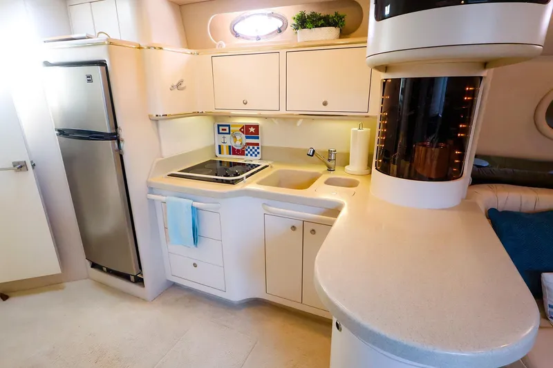 Slide: The Image of Luxurious 1998 Sea Ray 500 Sundancer yacht kitchen with modern appliances and sleek design. - 35