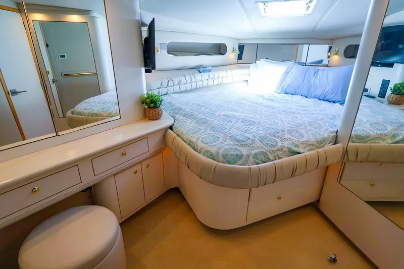 Slide: The Image of Luxurious bedroom interior of 1998 Sea Ray 500 Sundancer yacht with elegant furnishings. - 41