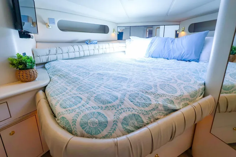 Slide: The Image of Luxurious bedroom interior of 1998 Sea Ray 500 Sundancer yacht with elegant bedding. - 42