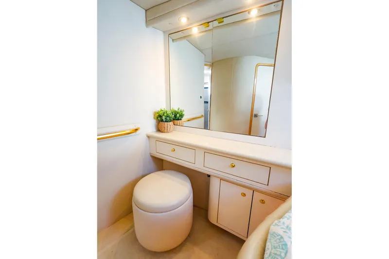 Slide: The Image of Luxurious vanity area on 1998 Sea Ray 500 Sundancer yacht with mirror and stool. - 44