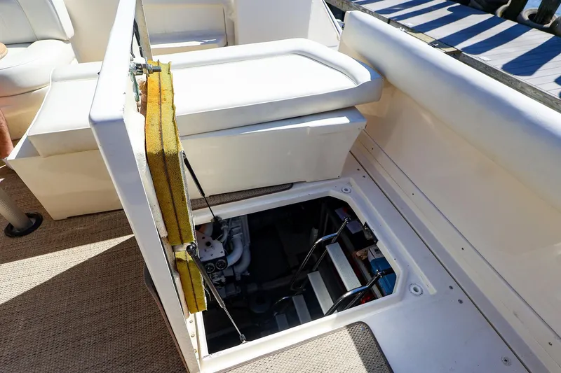 Slide: The Image of Open engine compartment on 1998 Sea Ray 500 Sundancer yacht, showcasing interior access. - 56