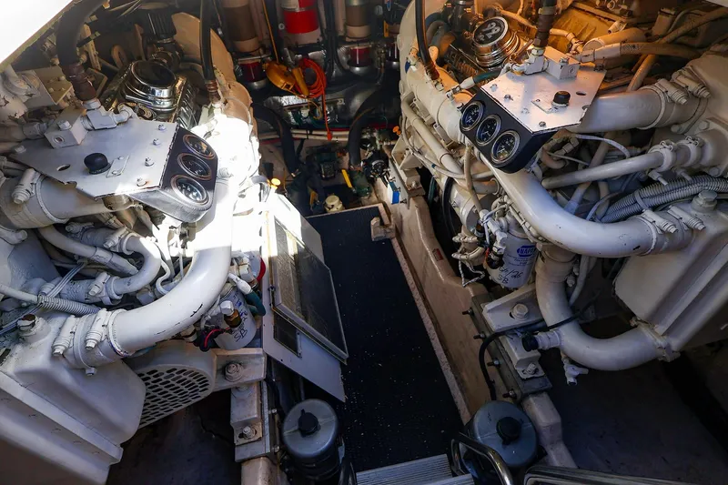 Slide: The Image of Engine room of a 1998 Sea Ray 500 Sundancer yacht, showcasing dual engines. - 60