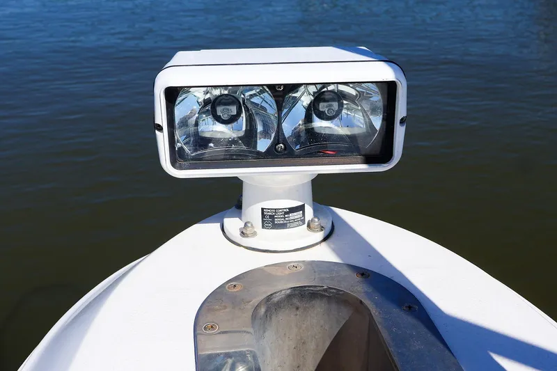Slide: The Image of Spotlight on 1998 Sea Ray 500 Sundancer boat, positioned on calm water. - 8