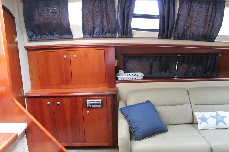 Slide: The Image of Luxurious interior of 2007 Cruisers Yachts 415 Express Motoryacht with wood cabinetry and plush seating. - 24
