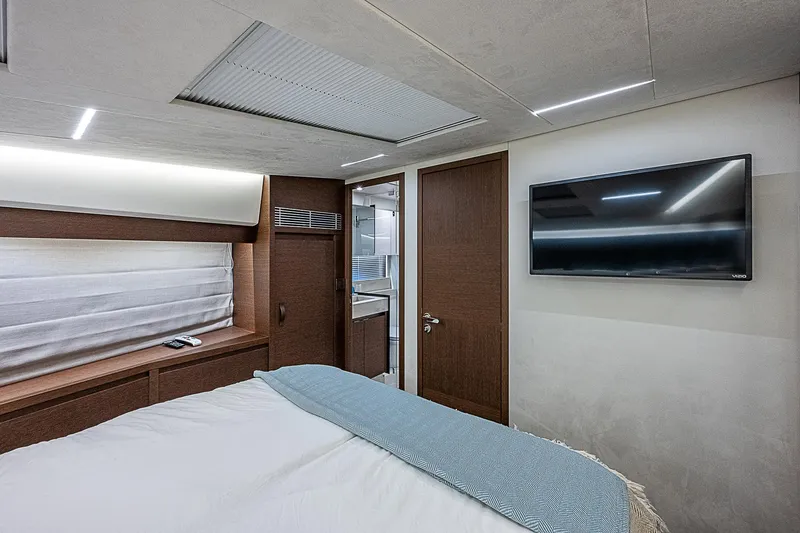 Slide: The Image of Luxurious bedroom interior of 2022 Prestige 520 Fly yacht with modern amenities. - 33