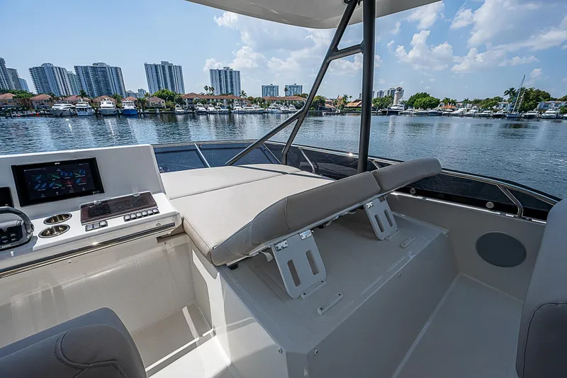 Slide: The Image of 2022 Prestige 520 Fly yacht interior with city skyline and waterfront view. - 9