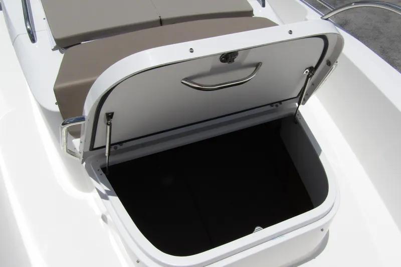 Slide: The Image of Open storage compartment on a 2025 Nimbus Tender 11 boat. - 10
