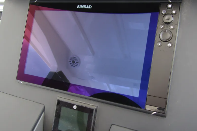 Slide: The Image of Simrad display on 2025 Nimbus Tender 11 boat dashboard. - 15