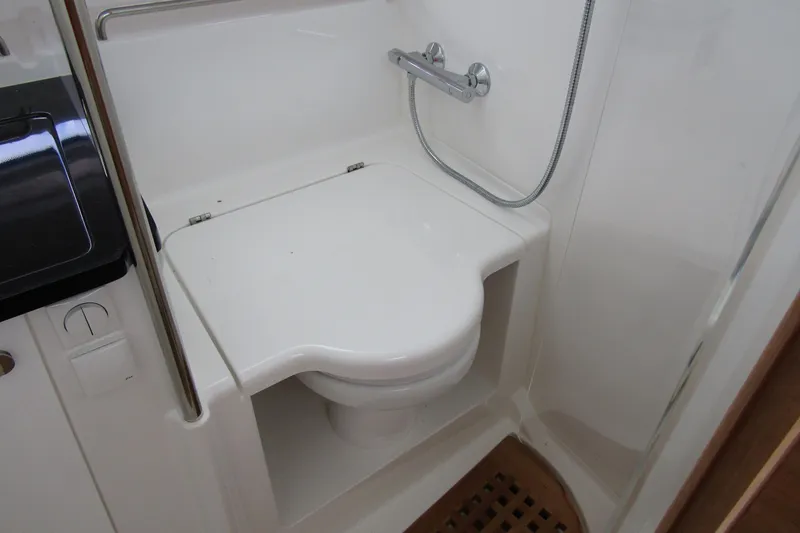 Slide: The Image of Compact bathroom with shower and toilet on 2025 Nimbus Tender 11 boat. - 28
