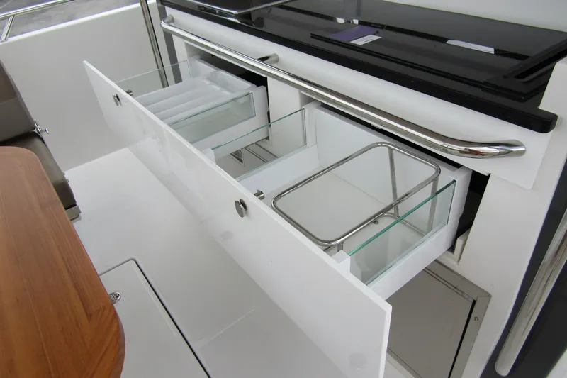 Slide: The Image of Open storage drawers on a 2025 Nimbus Tender 11 boat, showcasing sleek design. - 40