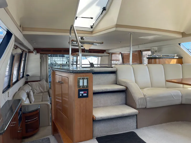 Slide: The Image of Interior of 2000 Carver 530 Voyager Pilothouse with luxurious seating and modern design. - 17
