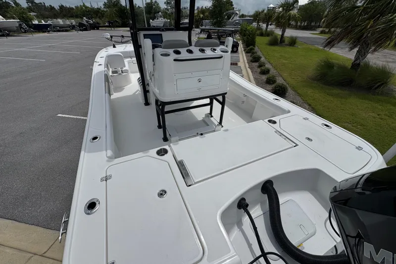 Slide: The Image of 2027 Caymas 26 HB boat interior, featuring spacious deck and modern console design. - 11
