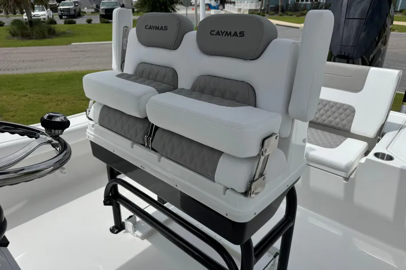 Slide: The Image of 2027 Caymas 26 HB boat seating with cushioned backrests and sleek design. - 18