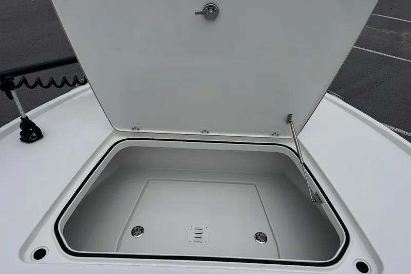 Slide: The Image of Open storage compartment on 2027 Caymas 26 HB boat, showcasing spacious interior design. - 29