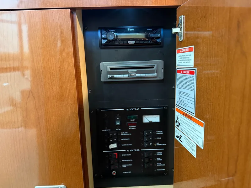 Slide: The Image of Electrical control panel inside a 2012 Sea Ray Sundancer 260. - 20