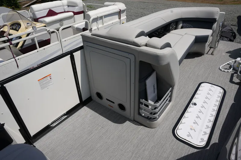 Slide: The Image of Interior of a Harris 250GM pontoon boat with gray seating and carpeted floor. - 17