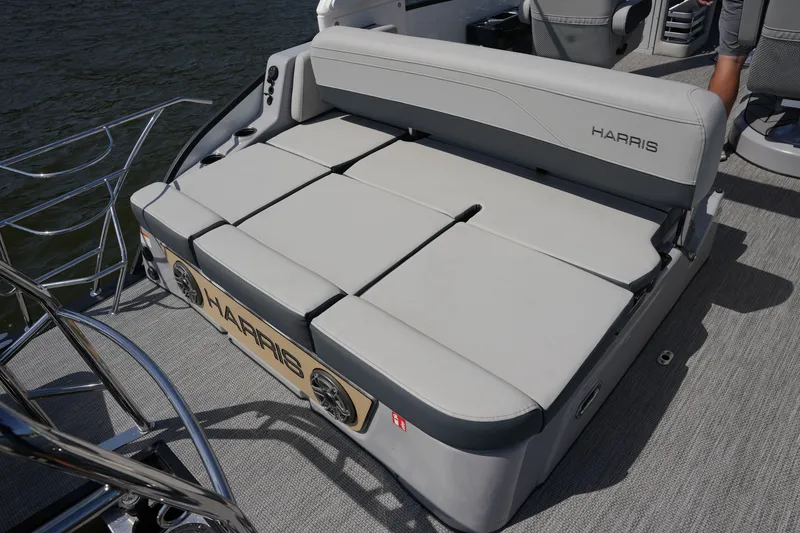 Slide: The Image of The image shows the stern of a Harris 250GM boat with gray upholstery. - 32