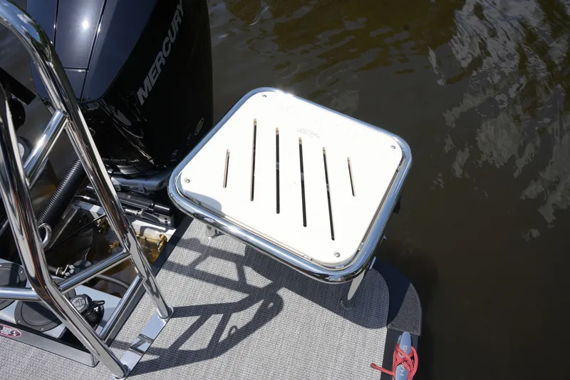 Slide: The Image of A platform at the rear of a boat with a Mercury engine. - 35