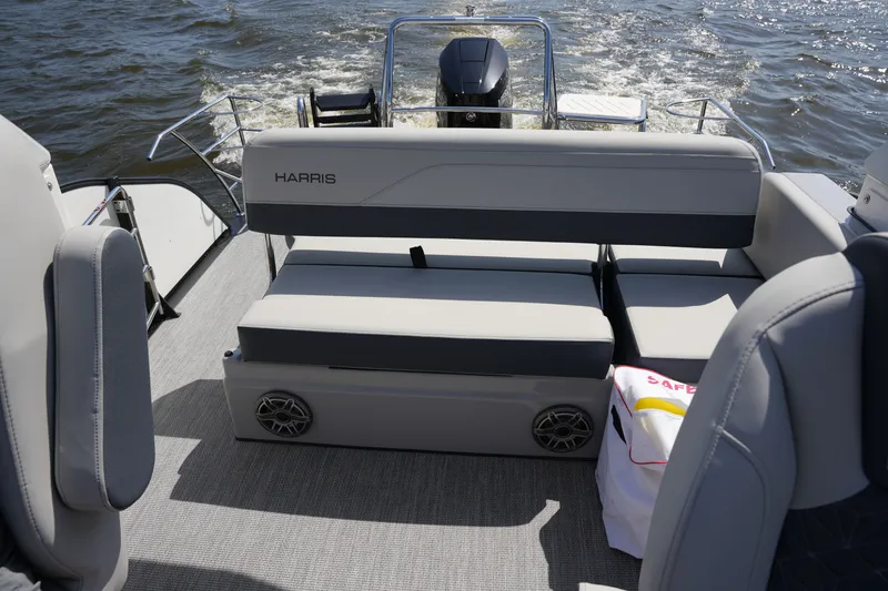 Slide: The Image of The image shows the stern of a Harris 250GM boat on the water. - 30