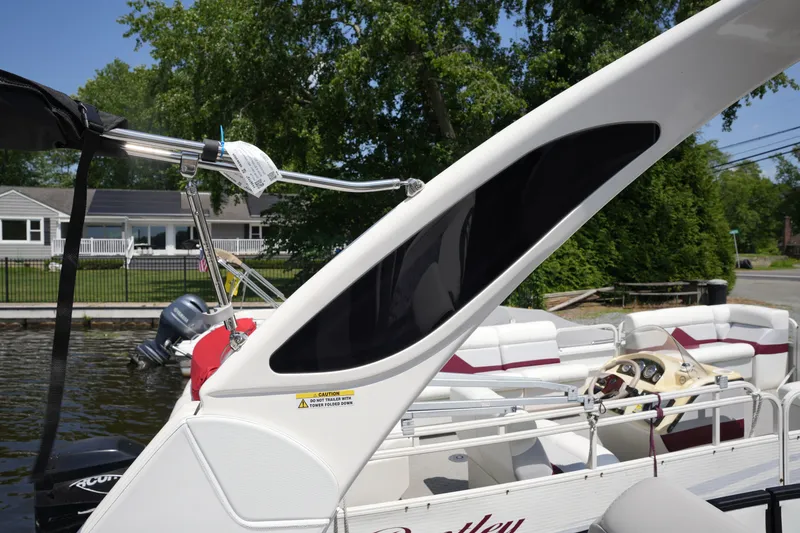 Slide: The Image of A modern pontoon boat with sleek seating and a stylish helm station. - 39