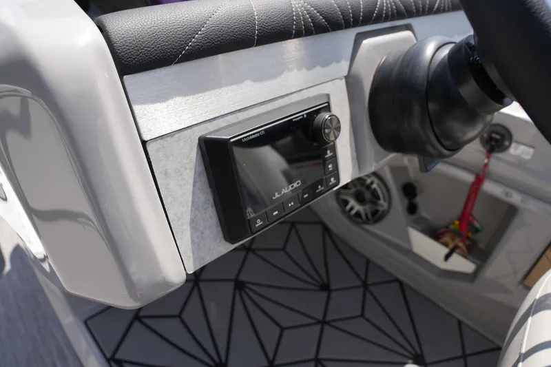 Slide: The Image of Close-up of a modern boat console area with an audio system and stylish design. - 26
