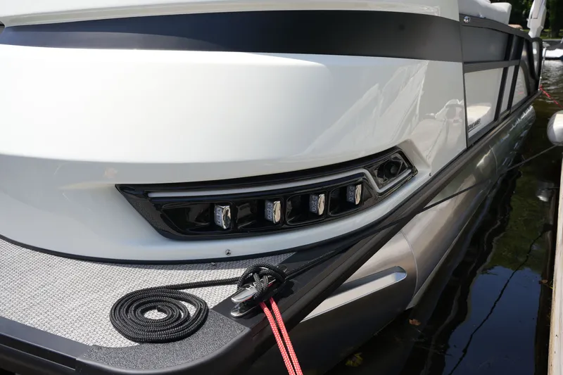 Slide: The Image of Close-up of a modern boat with sleek design and rope on the deck. - 11