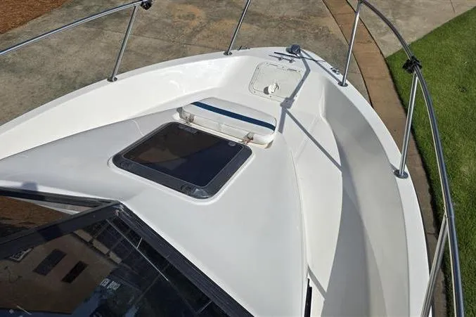 Slide: The Image of 1996 Bayliner Trophy Walkaround boat deck with hatch and railing. - 7