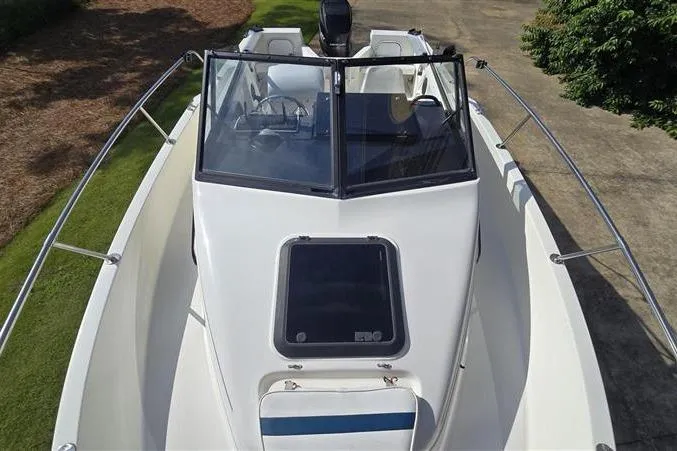 Slide: The Image of 1996 Bayliner Trophy Walkaround boat with sleek design and spacious deck area. - 9