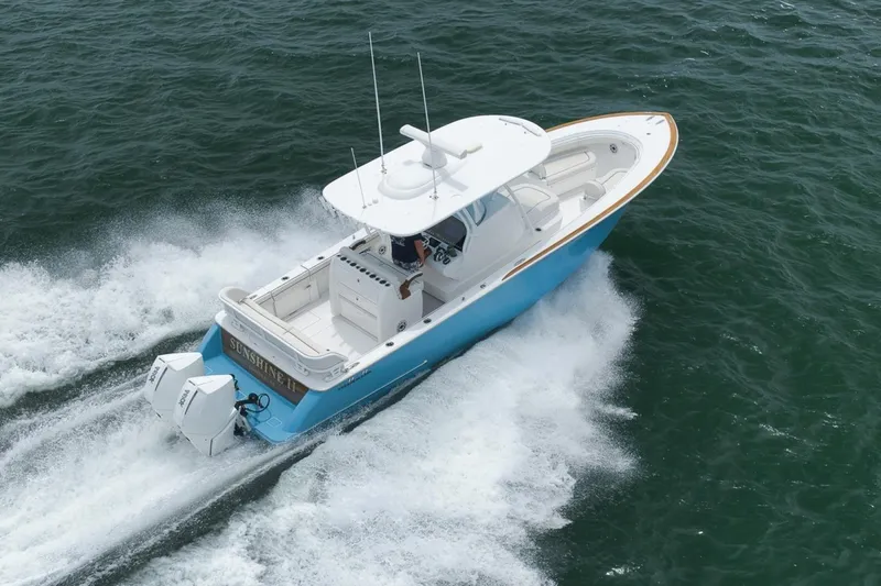 Slide: The Image of 2023 Valhalla Boatworks V-33 cruising on open water, showcasing sleek design and powerful engines. - 12
