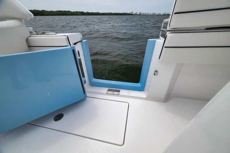 Slide: The Image of 2023 Valhalla Boatworks V-33, open side door, overlooking water and distant shoreline. - 46