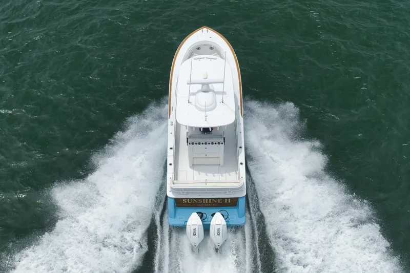 Slide: The Image of 2023 Valhalla Boatworks V-33 cruising on open water, aerial view. - 13