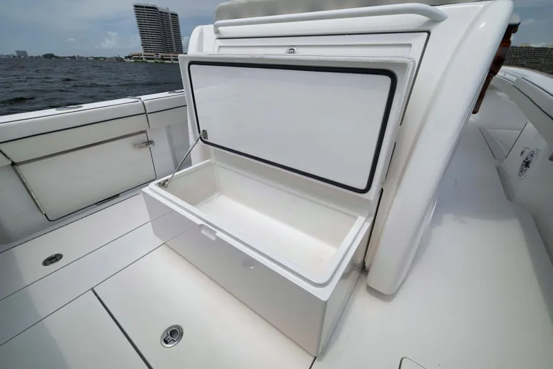 Slide: The Image of Open storage compartment on 2023 Valhalla Boatworks V-33, showcasing spacious interior design. - 45