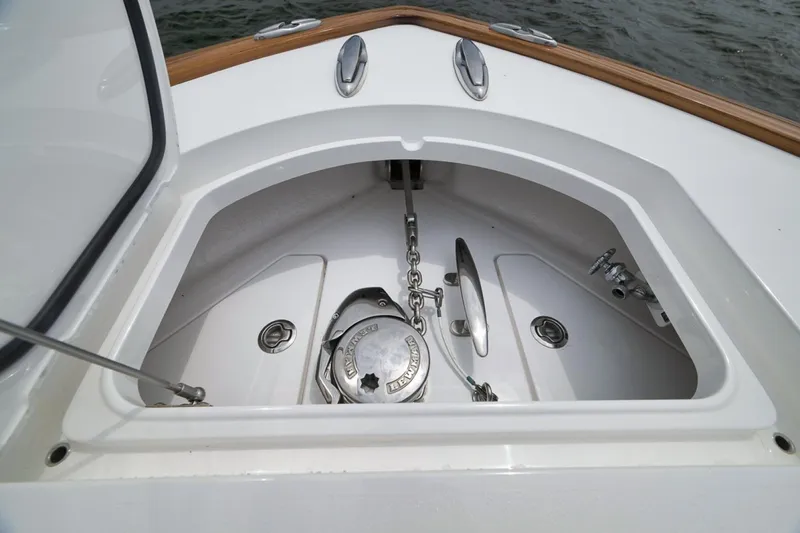 Slide: The Image of Anchor compartment of 2023 Valhalla Boatworks V-33, featuring chain and cleats. - 17