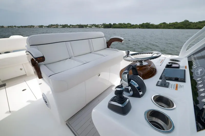 Slide: The Image of 2023 Valhalla Boatworks V-33 helm with luxurious seating and advanced controls on the water. - 34