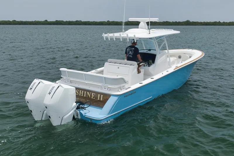 Slide: The Image of 2023 Valhalla Boatworks V-33 on water, featuring dual engines and sleek design. - 9