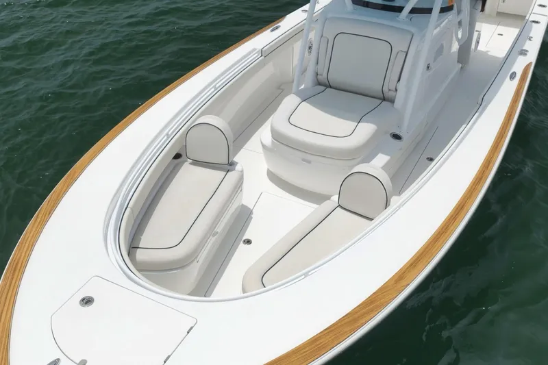 Slide: The Image of 2023 Valhalla Boatworks V-33 with sleek seating and elegant wood accents on the water. - 5