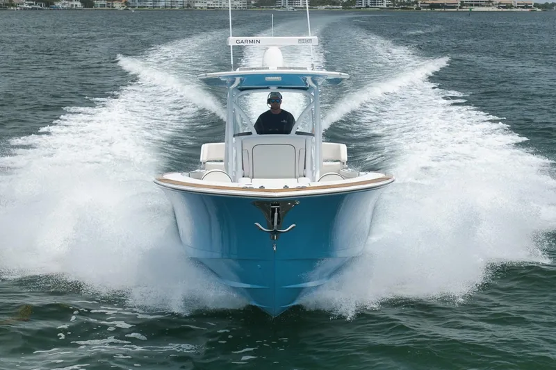 Slide: The Image of 2023 Valhalla Boatworks V-33 cruising on water, showcasing sleek design and performance. - 16