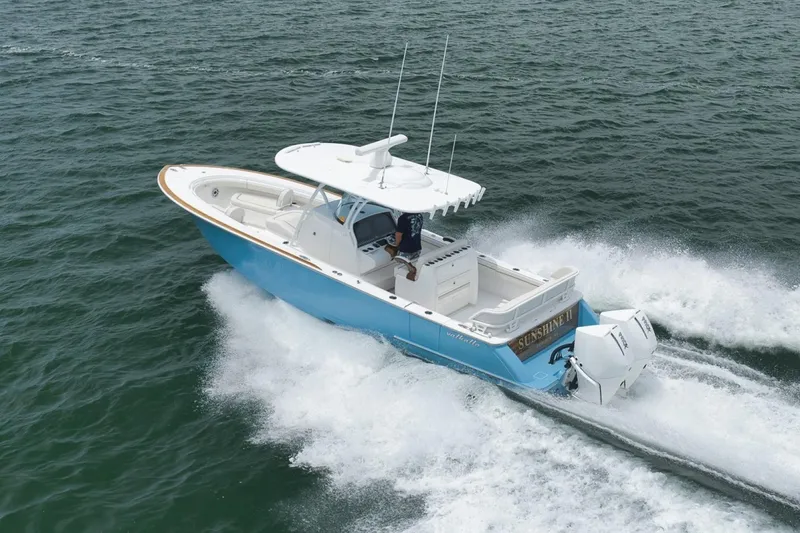 Slide: The Image of 2023 Valhalla Boatworks V-33 cruising on open water, showcasing sleek design and powerful engines. - 14