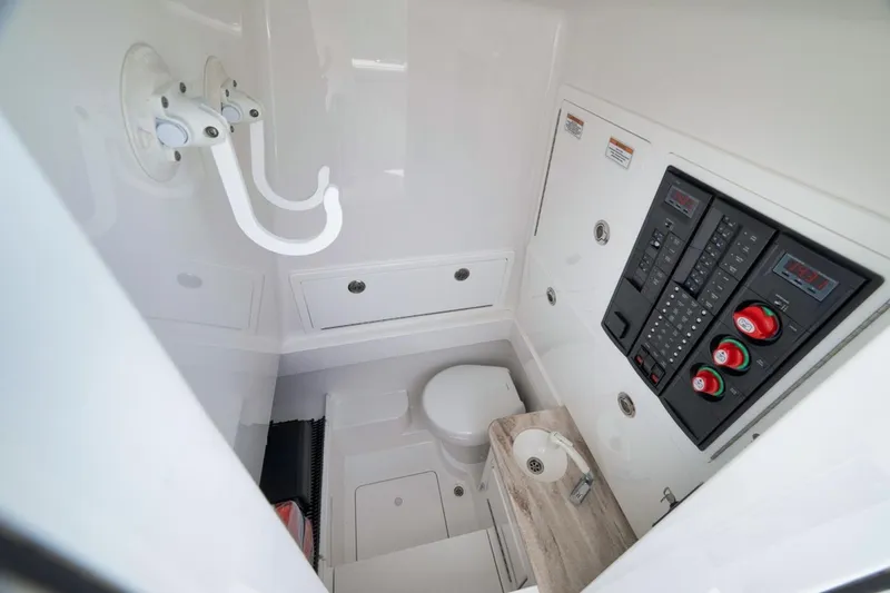 Slide: The Image of 2023 Valhalla Boatworks V-33 interior with control panel, sink, and storage. - 32